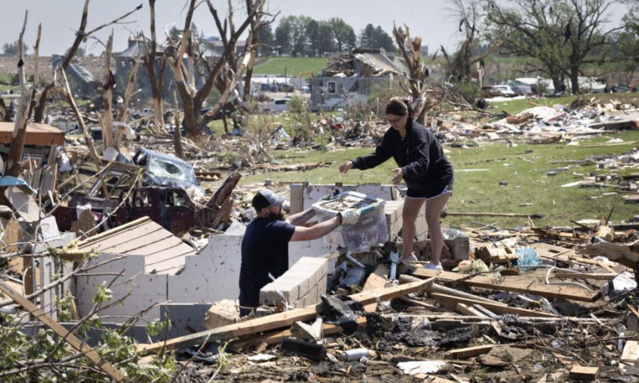 GREENFIELD, IOWA - MAY 22: Residents go through the damage after a tornado tore through town yesterday afternoon on May 22, 2024 in Greenfield, Iowa. Multiple deaths and injuries have been reported from a series of tornadoes and powerful storms that hit several Midwestern states (Photo by Scott Olson/Getty Images)